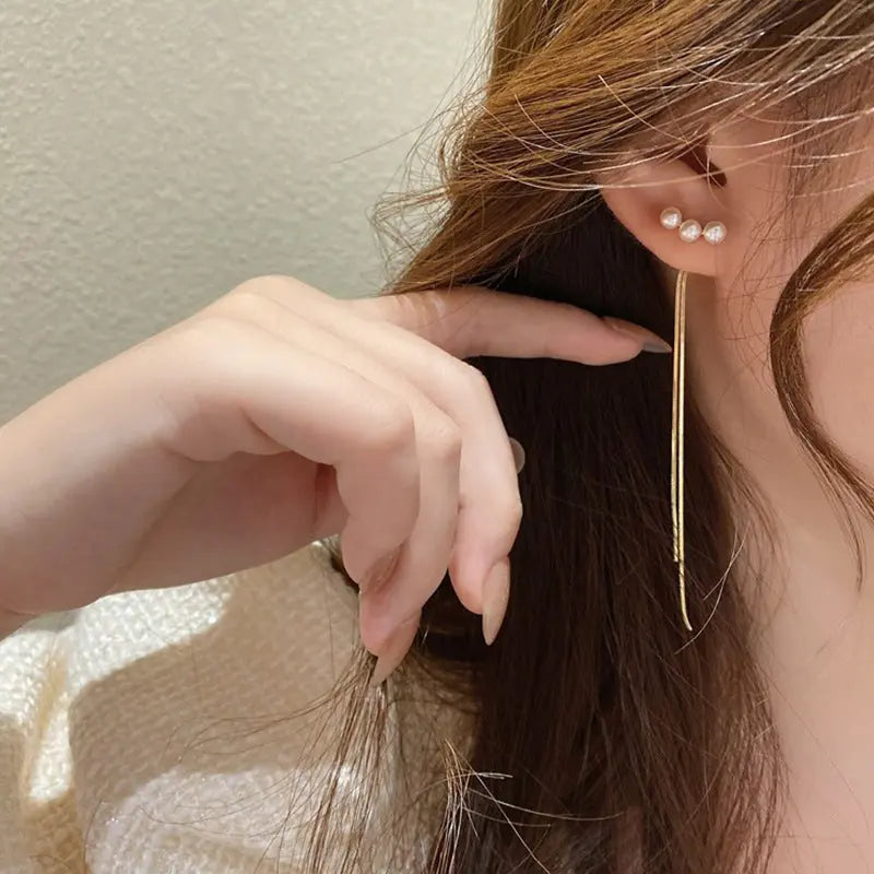 Elegant earring design features luxurious s925 silver pins and unique pearl tassel accents AQP-STORE