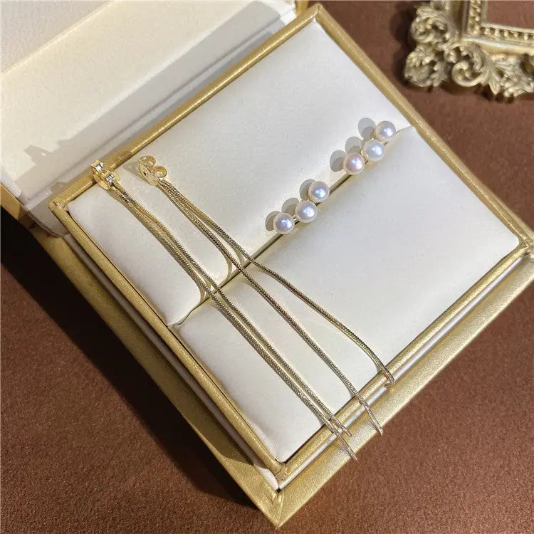 Elegant earring design features luxurious s925 silver pins and unique pearl tassel accents AQP-STORE
